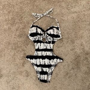 One-piece swimsuit by Venus.